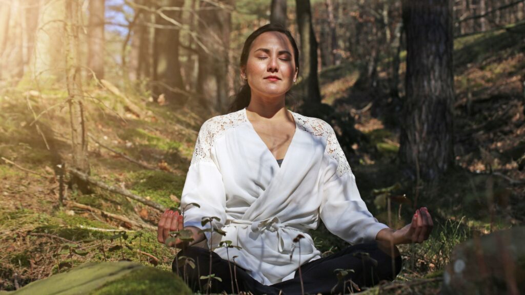 Person immersed in forest nature therapy